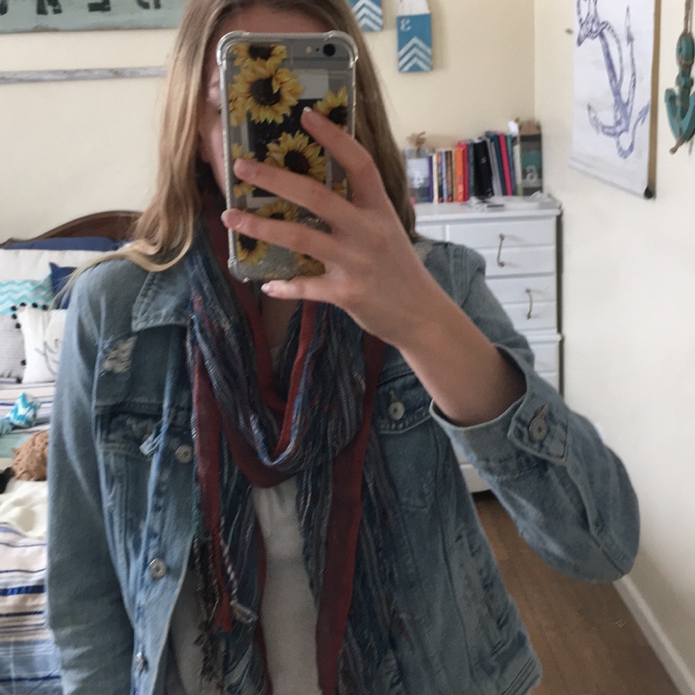 Light Scarf That Is Blue With Other Various Colors